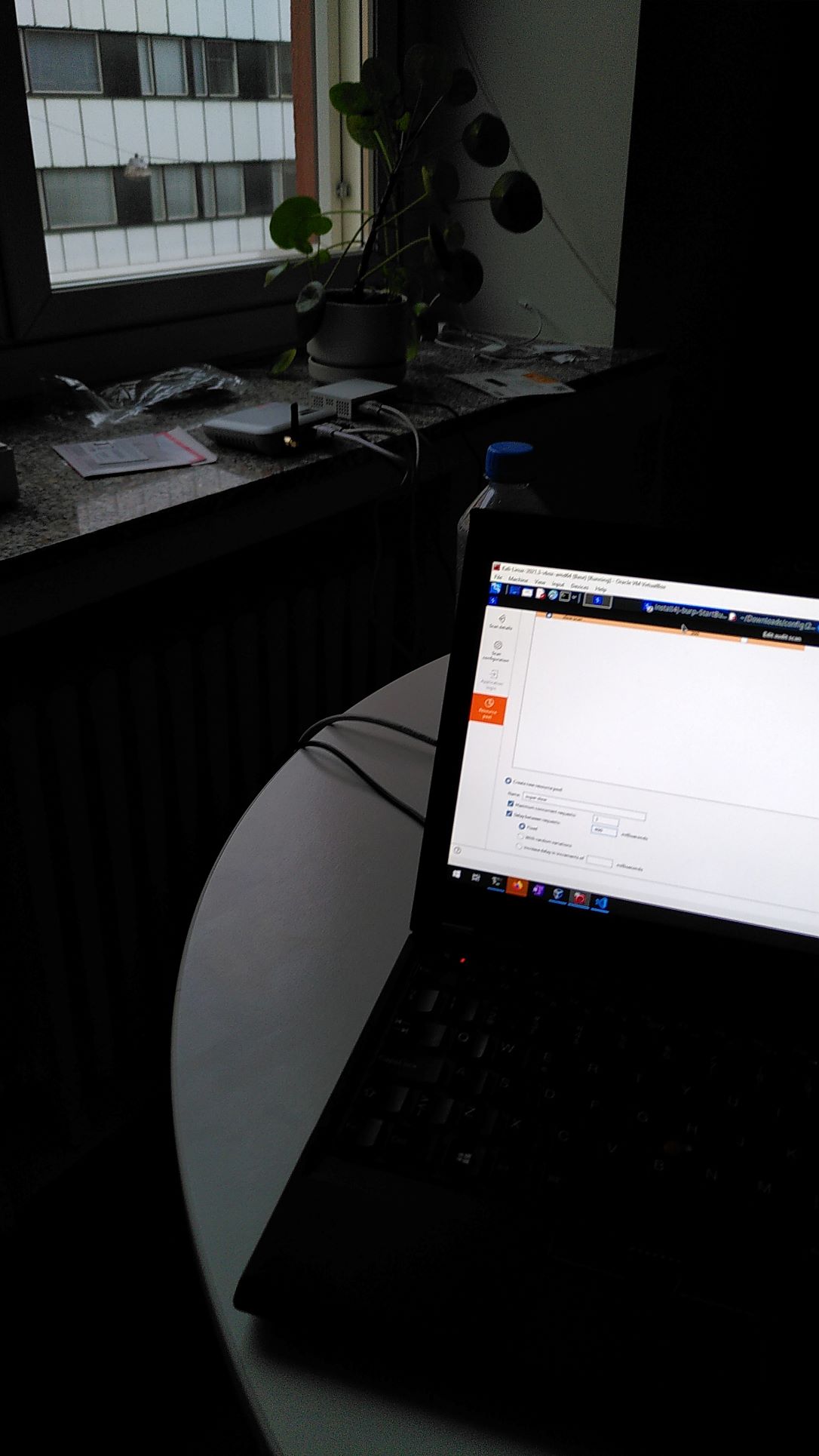 Laptop and GSM gateway in a dark apartment